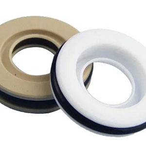 Glass-fiber reinforced PTFE seals resist virtually all chemicals and operate from -100°C to +260°C. They maintain low friction under extreme conditions, specified for pharmaceutical, semiconductor, and laboratory equipment requiring high purity or corrosion resistance.
