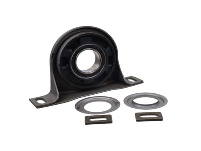 A center support bearing (carrier bearing) supports a split driveshaft at its midpoint.