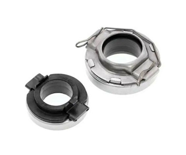 A mechanical type release bearing— sits between the clutch fork and the pressure plate’s diaphragm spring.